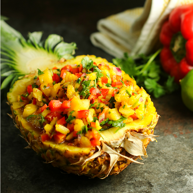 Bring the flavor of the tropics to your next BBQ with this easy sweet and spicy Pineapple Salsa! Impress your guests by serving it in a hollowed out pineapple!