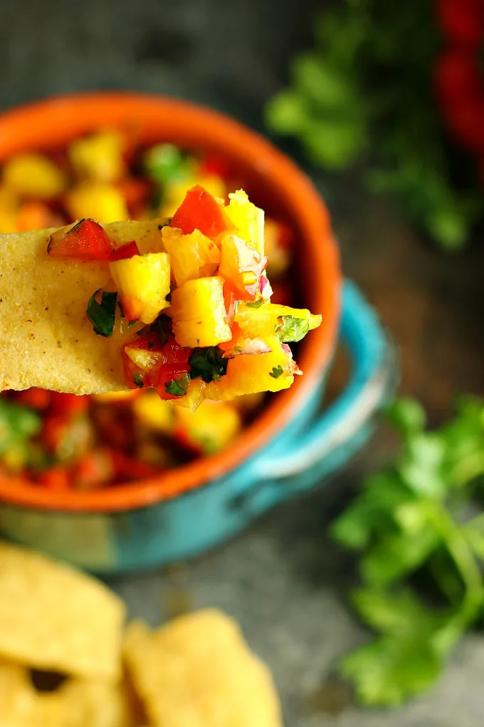 Take yourself back to the tropics at your next BBQ with this easy sweet and spicy Pineapple Salsa! Served with tortilla chips, it's perfect for potlucks, picnics or BBQs, but it's also great as a topper for chicken or fish!