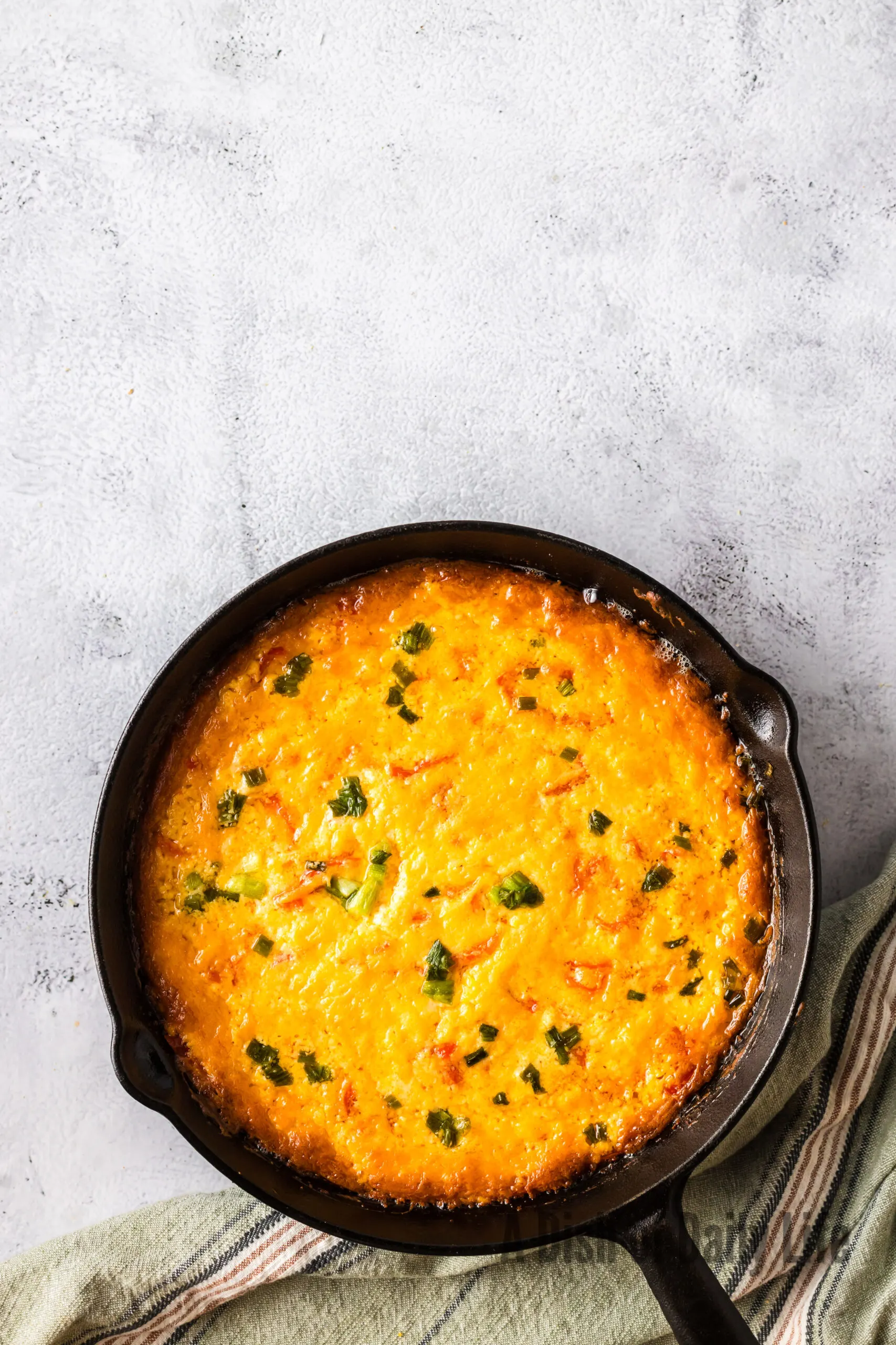 baked cheese dip with peppadews in skillet