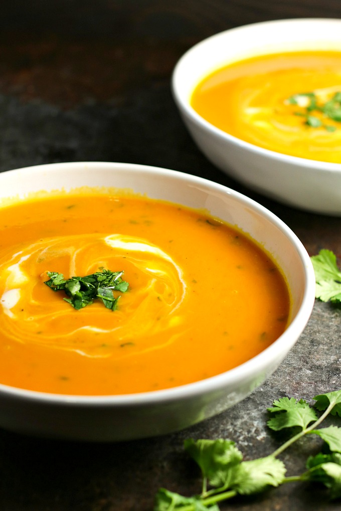 Gingered Butternut Squash Soup…a combination of butternut squash, sweet potato, carrots, and apples, accented by the delicate sweetness of ginger, and finished off with rich, creamy crème fraiche and cilantro. A delicious soup worthy of a special occasion! #butternutsquash #soup #holidayrecipes #Christmas #Thanksgiving 