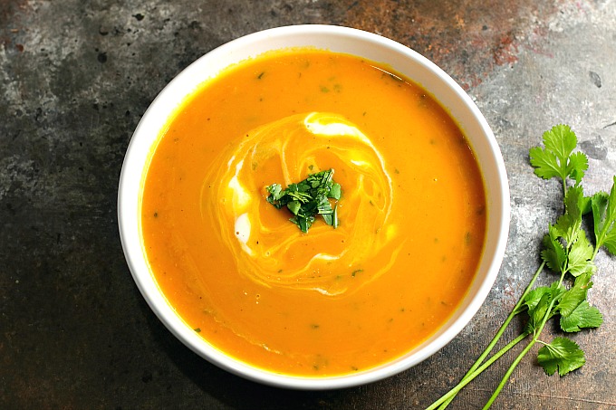 Gingered Butternut Squash Soup…a combination of butternut squash, sweet potato, carrots, and apples, accented by the delicate sweetness of ginger, and finished off with rich, creamy crème fraiche and cilantro. A delicious soup worthy of a special occasion! #butternutsquash #soup #holidayrecipes #Christmas #Thanksgiving 