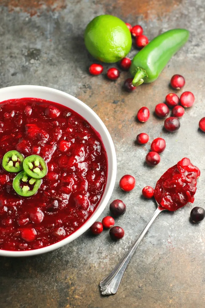 Jalapeños and lime give this Spicy Jalapeño Cranberry Sauce a unique flavor all its own. You're going to love the combination of the sweet, tart and spicy! #cranberrysauce #Thanksgiving #Christmas #appetizer #sidedish #holidayrecipe