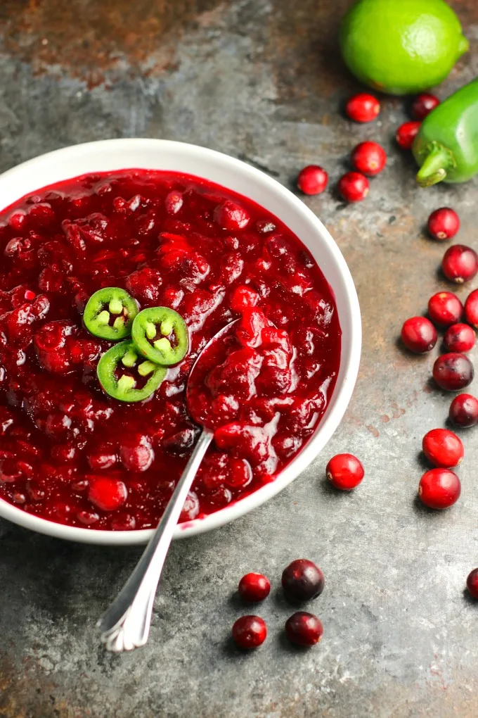 Jalapeños and lime give this Spicy Jalapeño Cranberry Sauce a unique flavor all its own. You're going to love this combination of sweet, tart and spicy! #cranberrysauce #Thanksgiving #Christmas #appetizer #sidedish #holidayrecipe