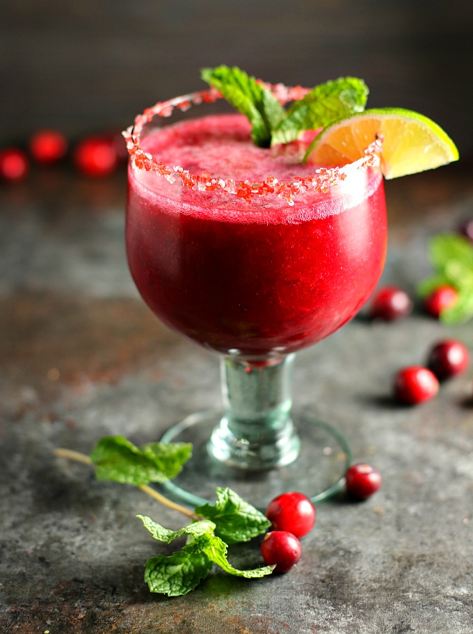 Celebrate the holidays with this Jalapeño Cranberry Vodka Slushie! This fabulous cocktail is tart and sweet, with just a little bit of a kick. It'll be the hit of the party! #cocktail #slushie #cranberry #vodka #holidaycocktails