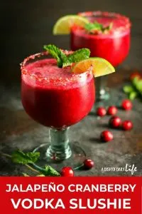 Celebrate the holidays with this Jalape&ntilde;o Cranberry Vodka Slushie! This fabulous cocktail is tart and sweet, with just a little bit of a kick. It'll be the hit of the party! #cocktail #slushie #cranberry #vodka #holidaycocktails
