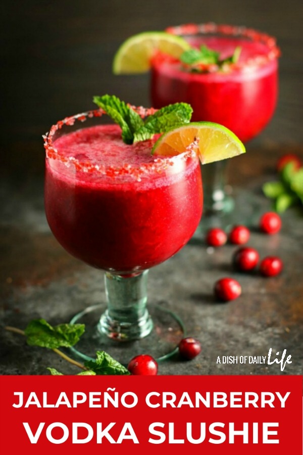 Celebrate the holidays with this Jalapeño Cranberry Vodka Slushie! This fabulous cocktail is tart and sweet, with just a little bit of a kick. It'll be the hit of the party! #cocktail #slushie #cranberry #vodka #holidaycocktails