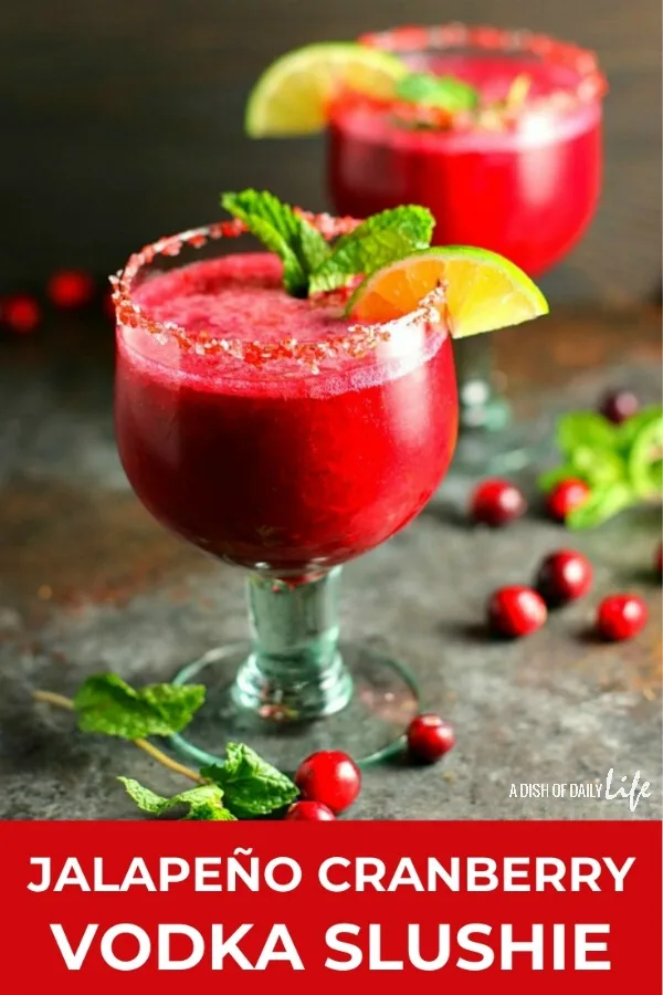 Celebrate the holidays with this Jalapeño Cranberry Vodka Slushie! This fabulous cocktail is tart and sweet, with just a little bit of a kick. It'll be the hit of the party! #cocktail #slushie #cranberry #vodka #holidaycocktails