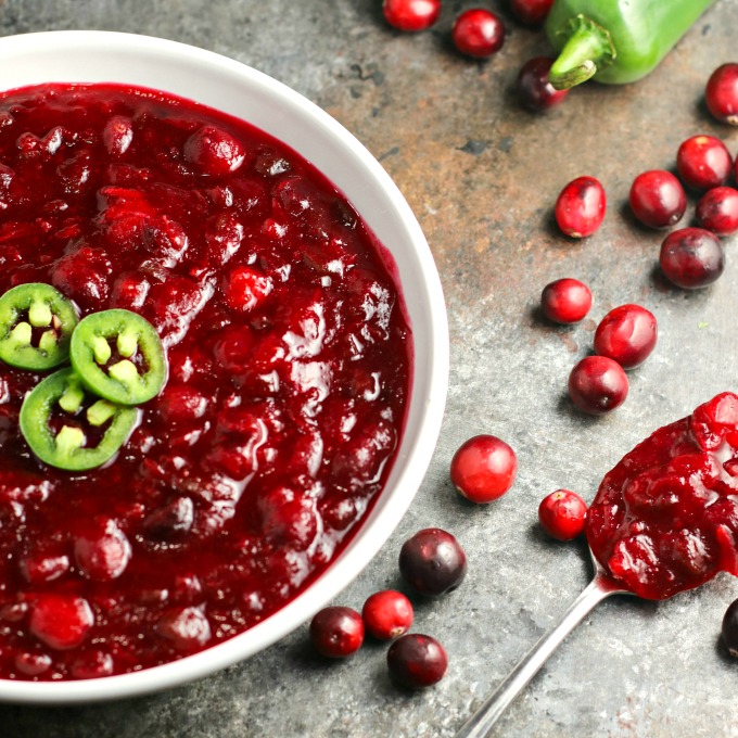 Jalapeños and lime give this Spicy Cranberry Sauce a unique flavor all its own. You're going to love the combination of the sweet, tart and spicy! #cranberrysauce #Thanksgiving #Christmas #appetizer #sidedish #holidayrecipe