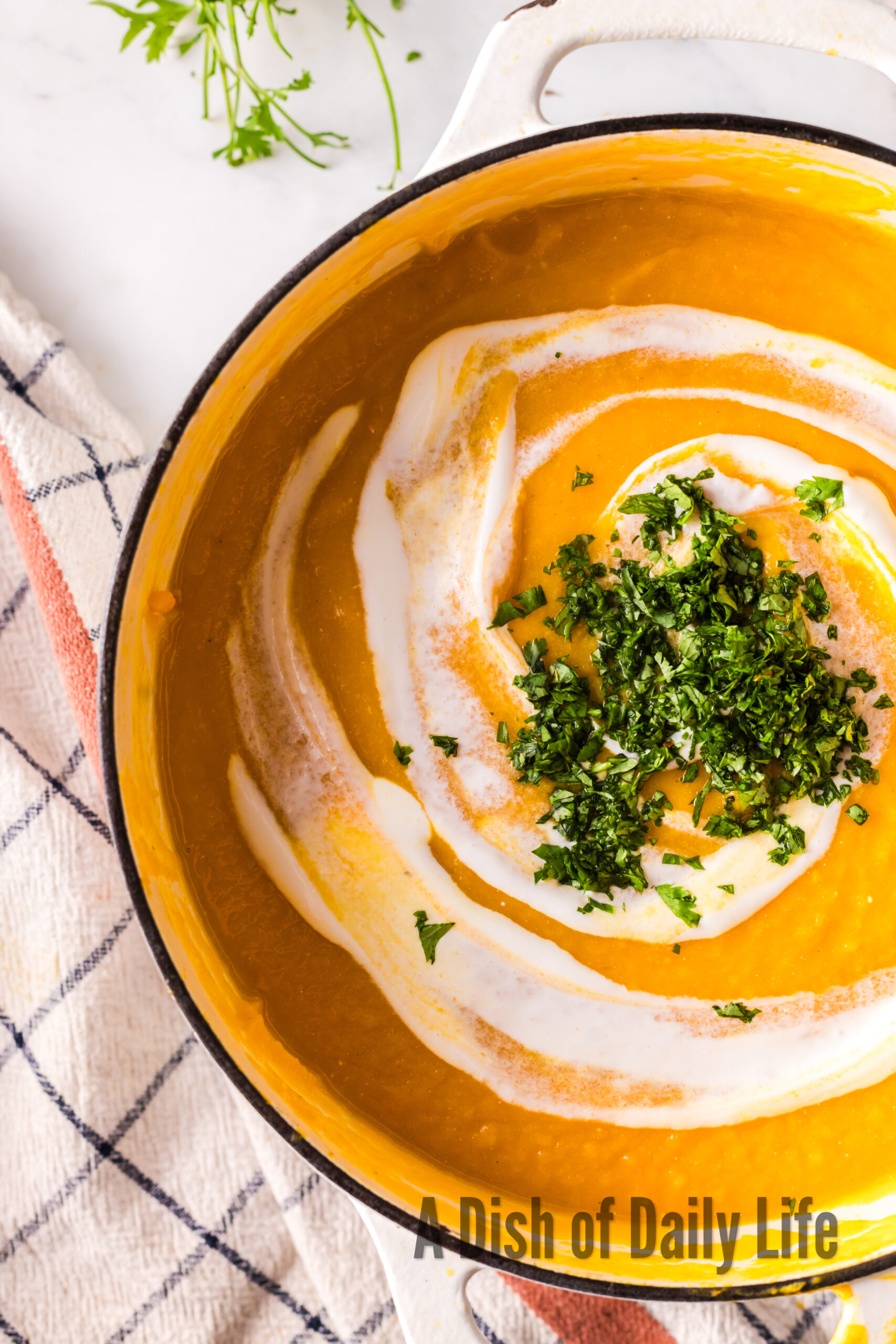 additional creme fraiche on top of soup in pot.