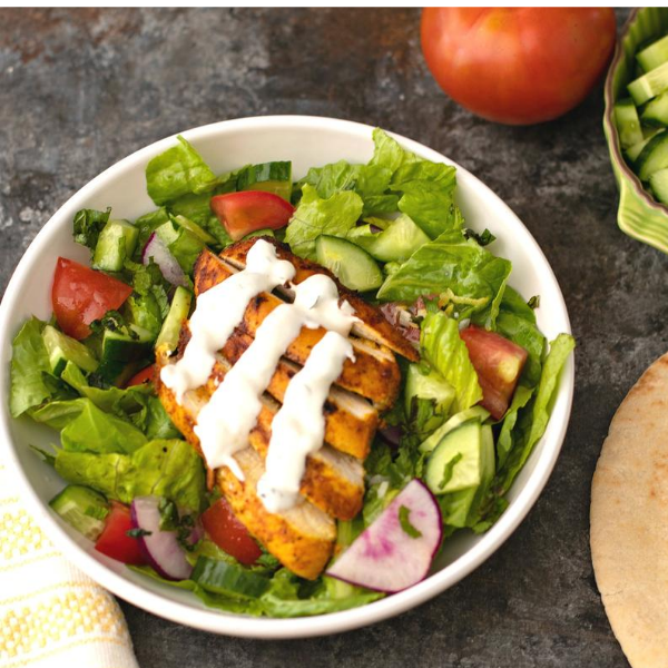 Chicken over salad with Greek Yogurt Tahini Sauce