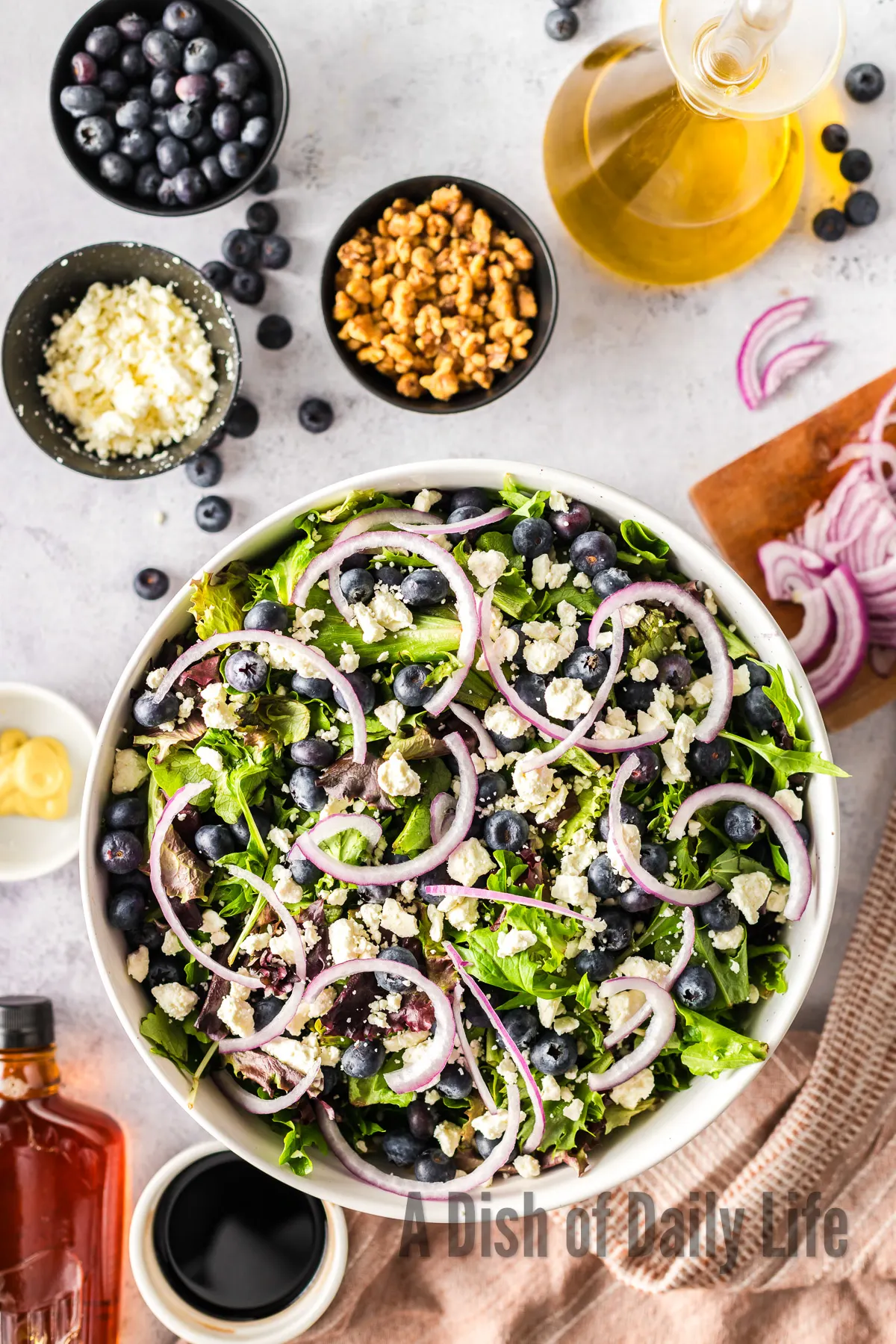 Red onion sliced spread over the top of the salad