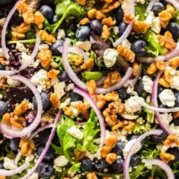 zoomed in image of prepared salad in a serving bowl.