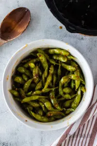 bowl full of coated edamame ready to serve.
