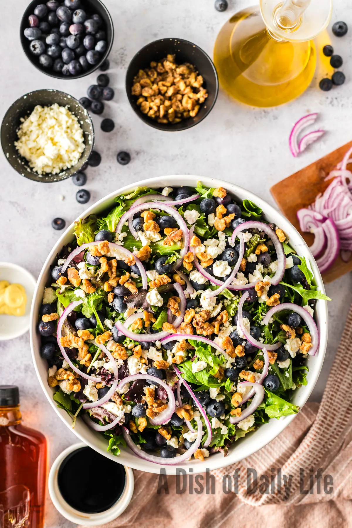 Chopped nuts spread over the top of the salad