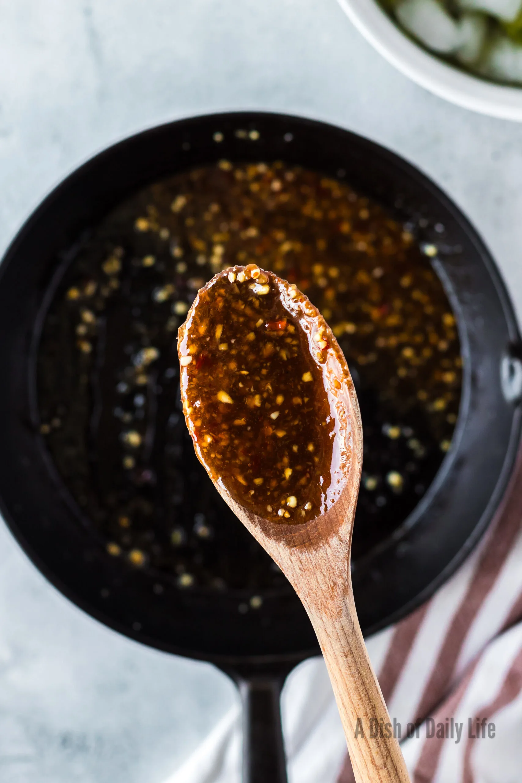 Sweet Chili sauce ready to be poured over edamame