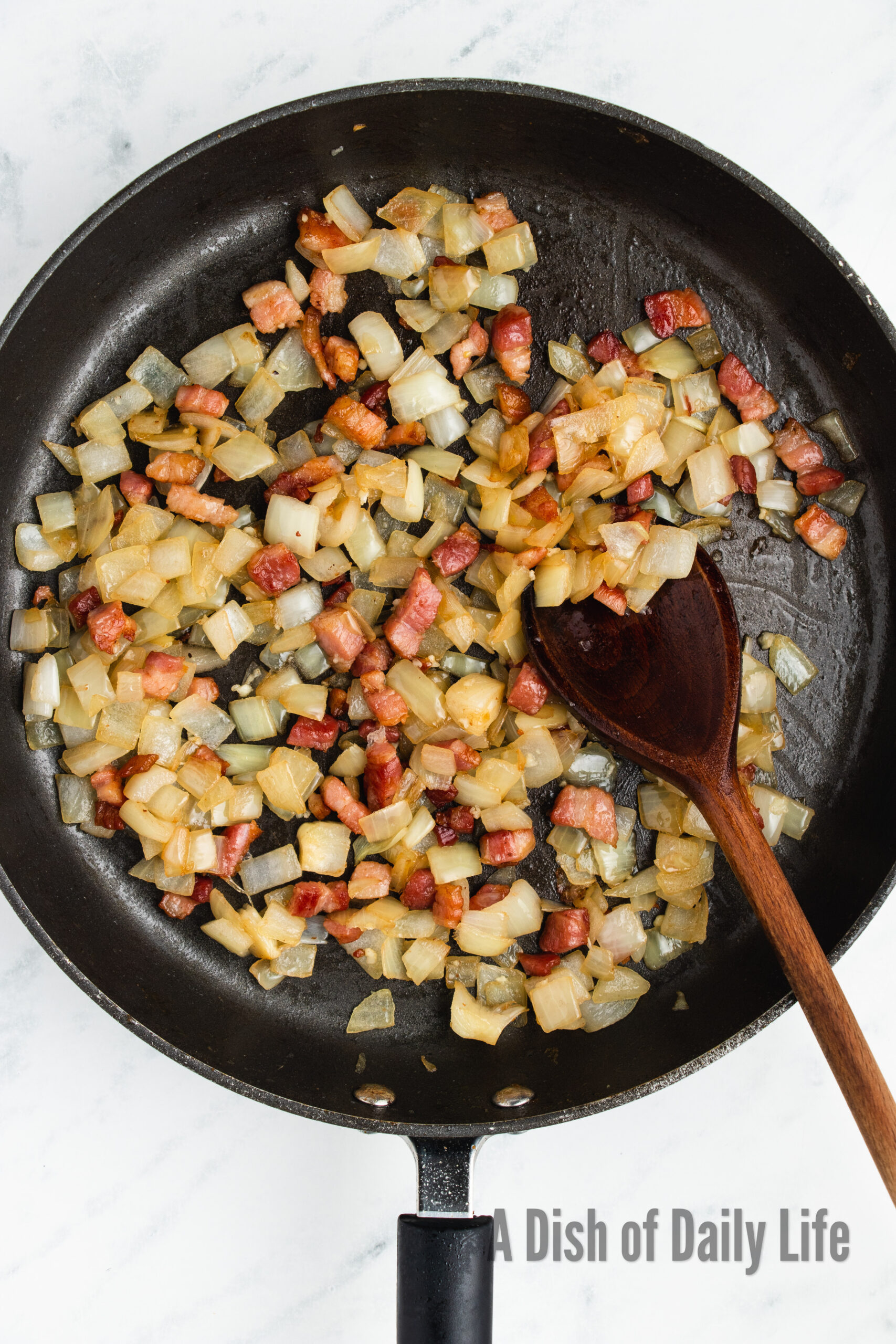 pan of sautéed chicken and onions