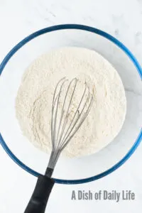 Flour, baking powder and salt mixed in a new bowl