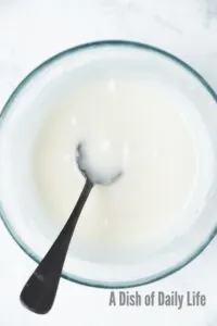 powdered sugar and lemon juice mixed in a bowl to create an icing.