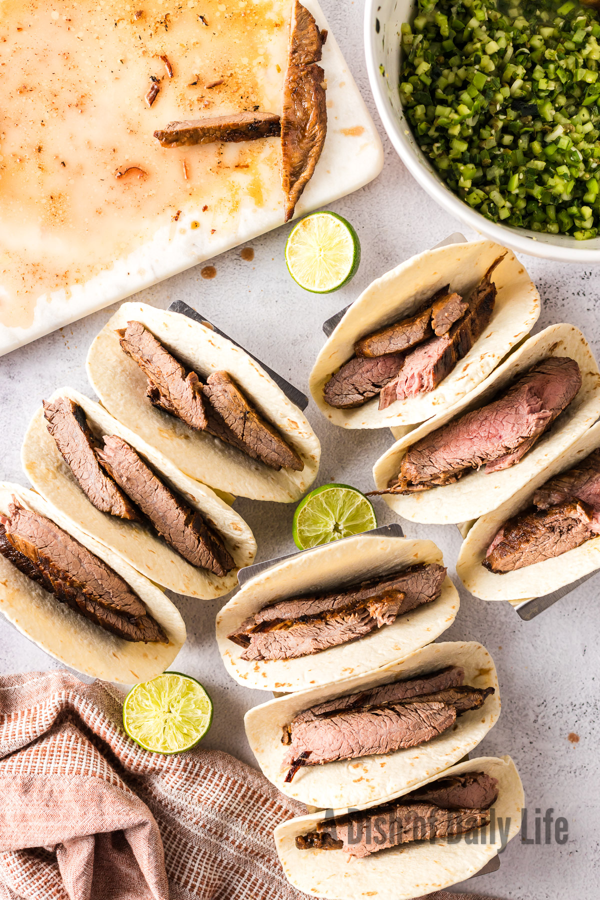 sliced flank steak inside a flour tortilla