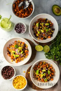 Avocado added on top of corn, black beans, sweet potatoes and farro