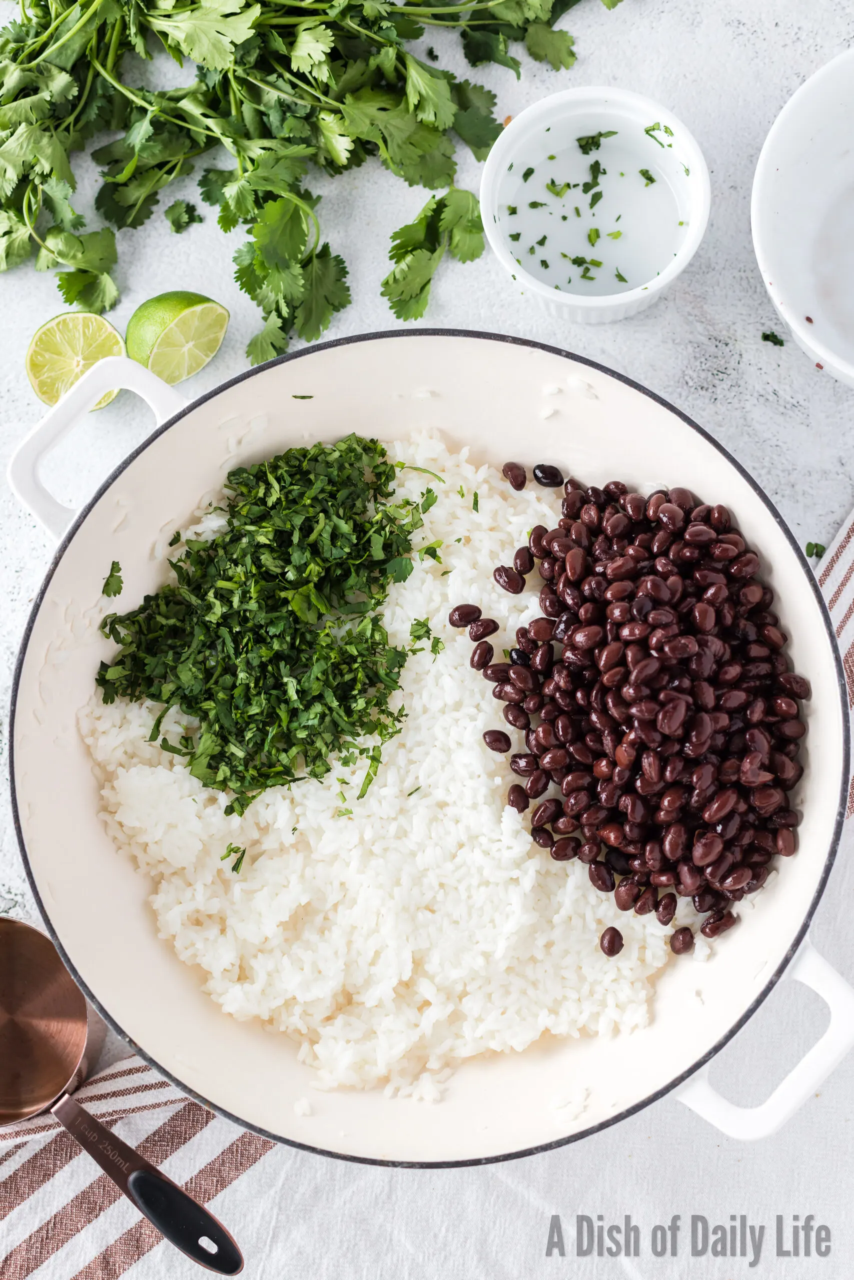 Cooked rice with lime juice, cilantro and black beans added