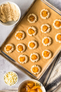 Round dent pressed into each cookie and filled with pie filling.