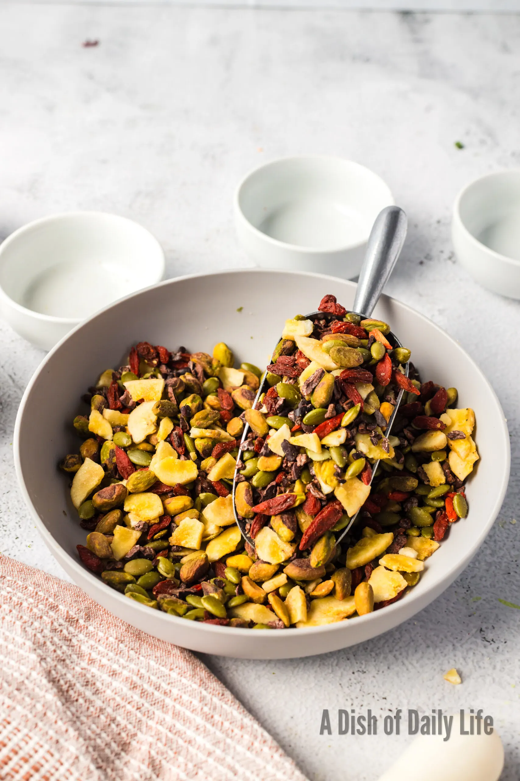 side view of healthy natural trail mix in a bowl and ready to serve.