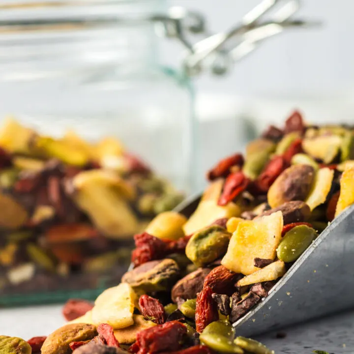 zoomed in image of a scoop of healthy trail mix on the counter