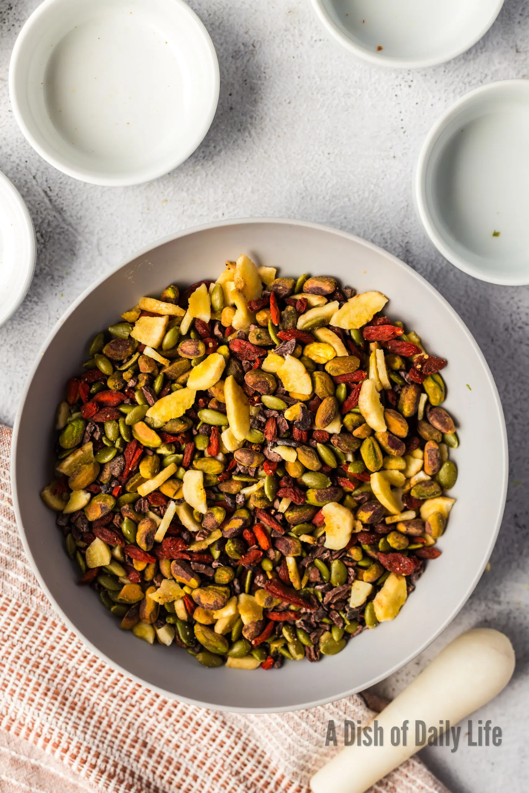 Trail mix in bowl, all mixed up.