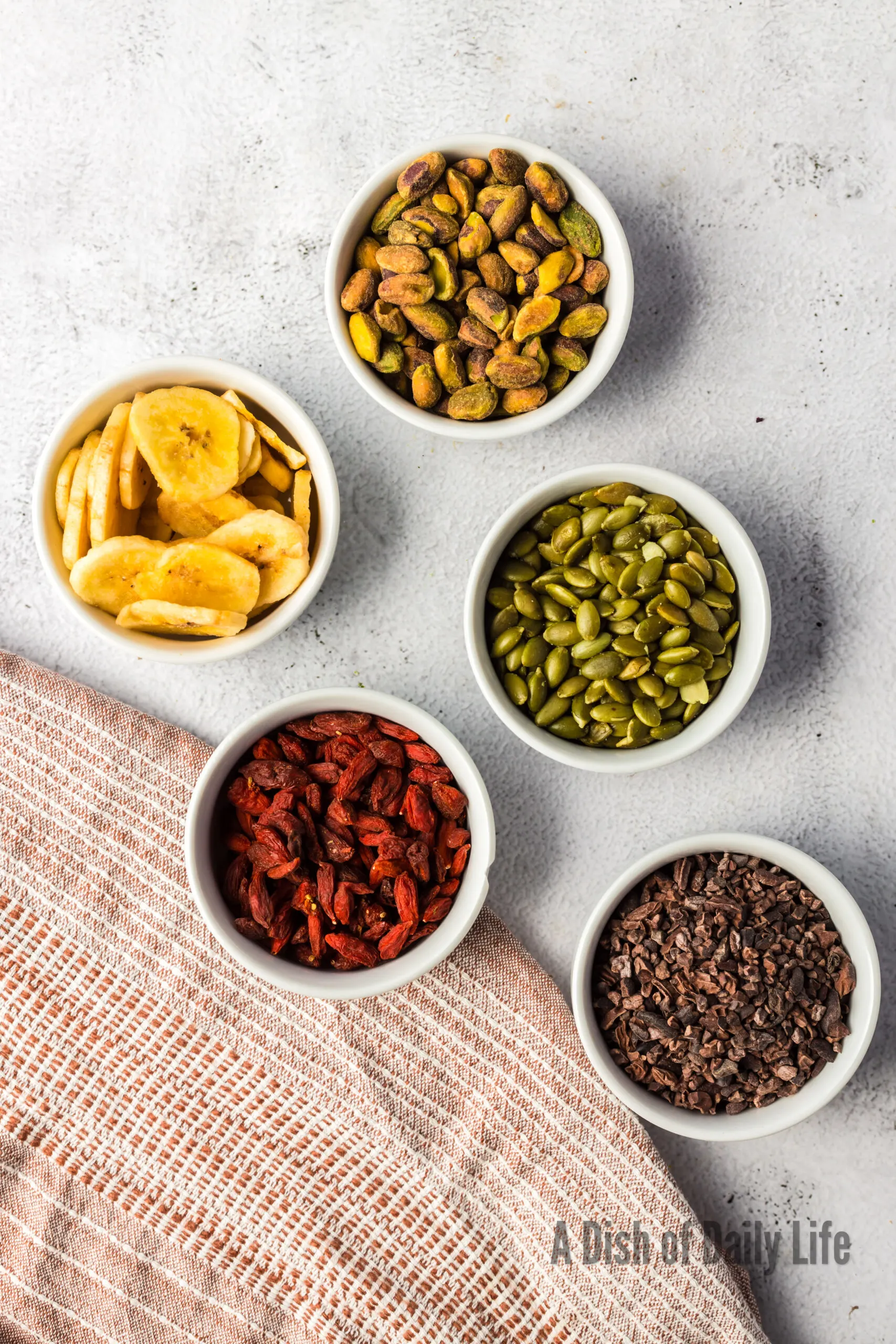 All ingredients for trail mix laid out on counter