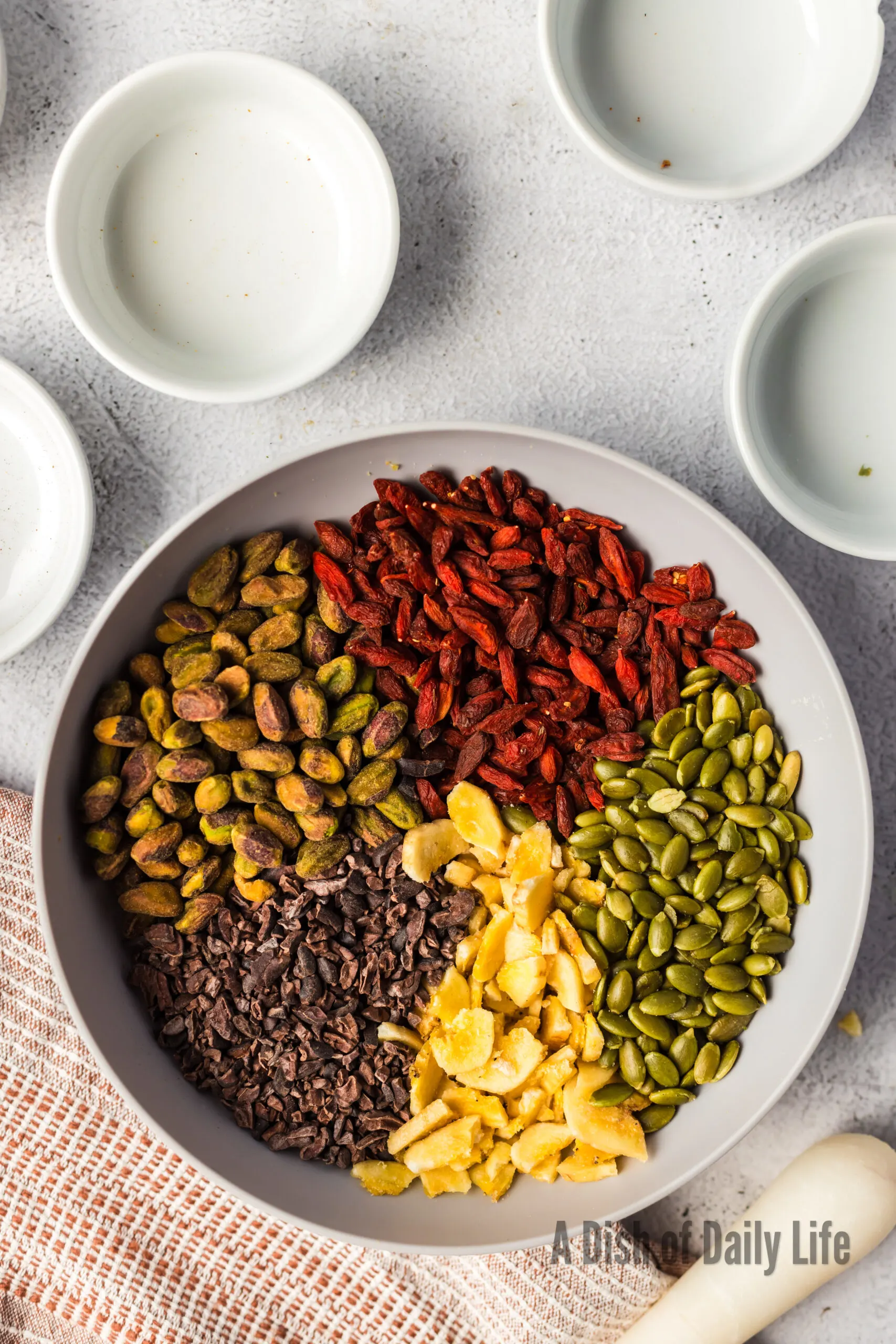 All ingredients for trail mix in a bowl, unmixed
