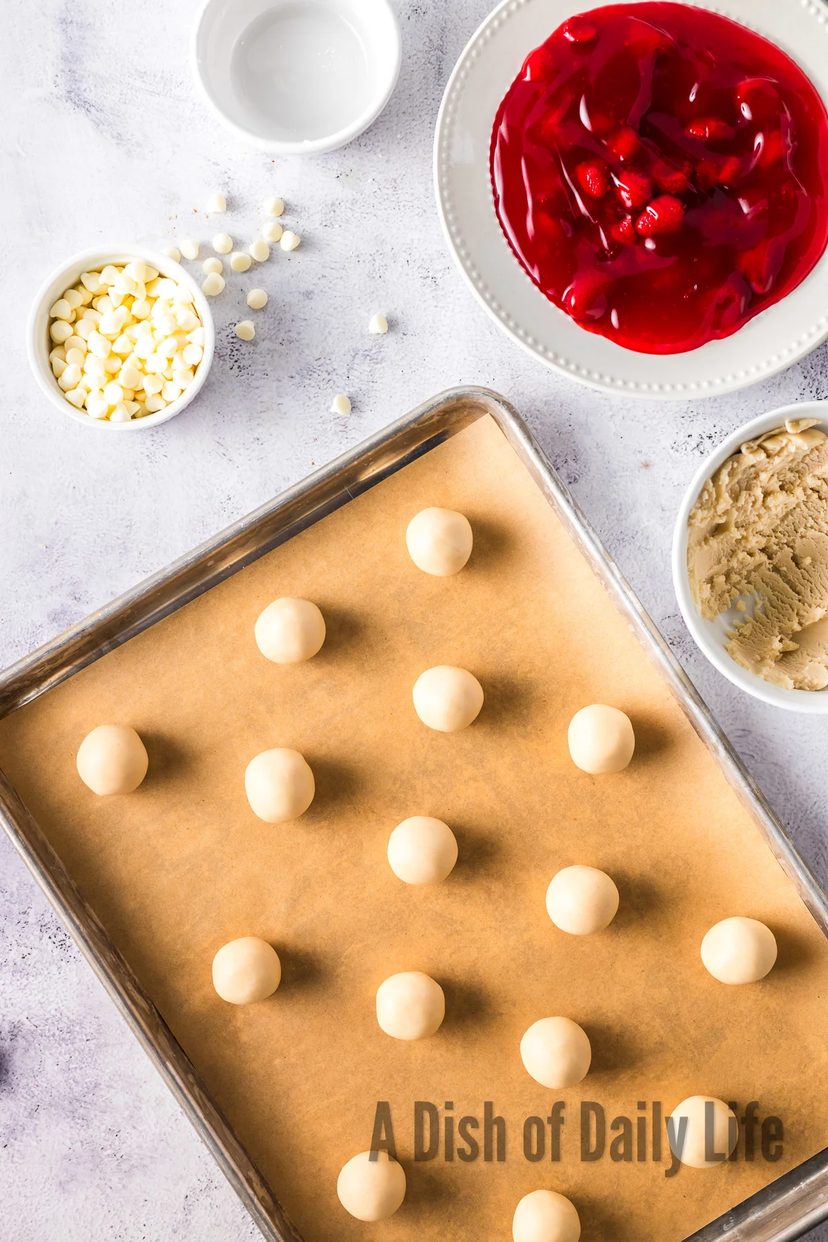 dough divided into small balls and put on a lined cookie sheet.