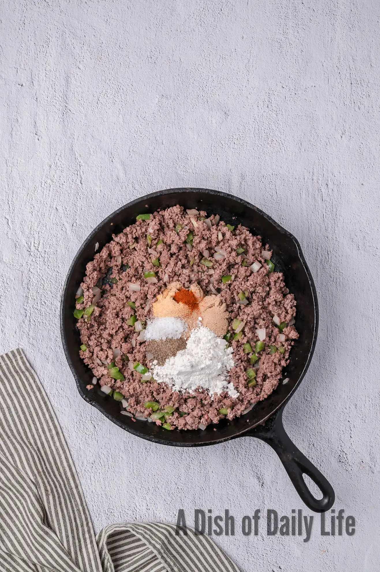 cooked ground beef mixture with seasonings added.
