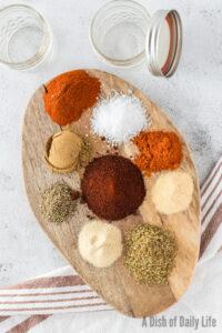Fajita seasoning ingredients laid out on a board.